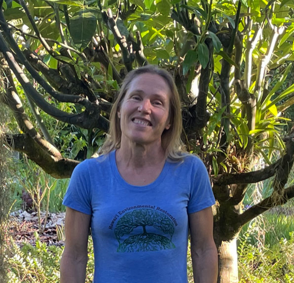 Jaya Dupuis, president of Hawaii Environmental Resources modeling the HER logo t-shirt